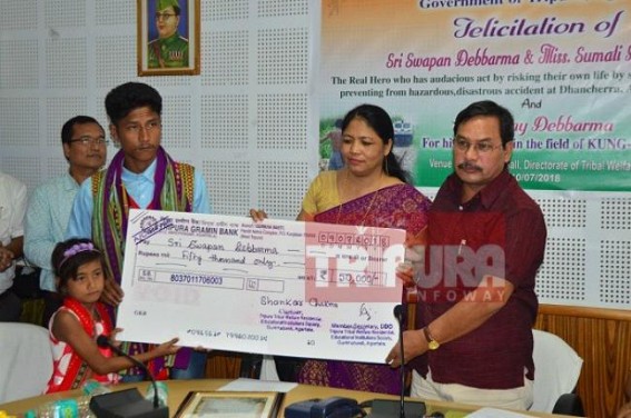 Tribal Welfare Dept handed over Rs. 50,000 cheque to train-passenger savior Swapan Debbarma